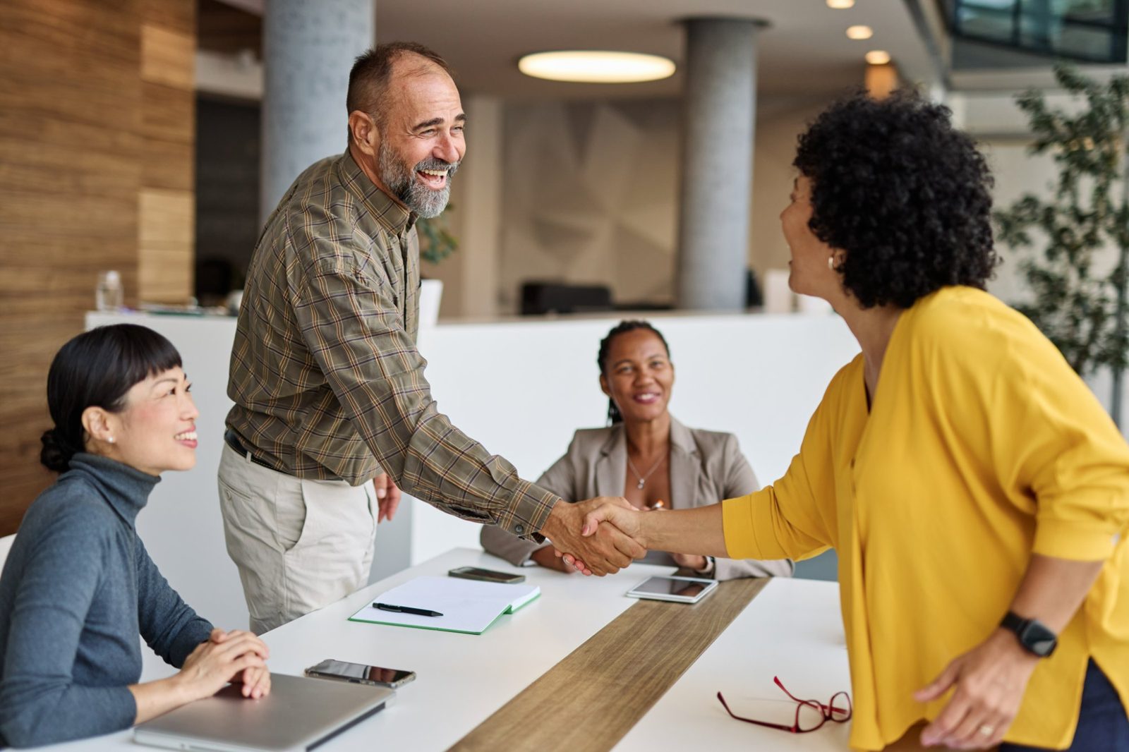 IPS team shaking hands with a new customer